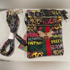 Graffiti crossbody double zip bag. $30 each
